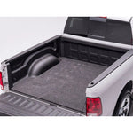 Husky Liners Guardian Comfort 66x98 inch universal trim-to-fit polypropylene truck bed mat with a gray carpet-style texture.
