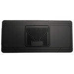 Husky Liners Classic Style black rubberized center hump floor mat with StayPut Cleats and raised ridges.
