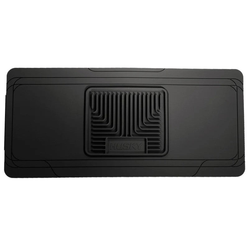 Husky Liners Classic Style black rubberized center hump floor mat with StayPut Cleats and raised ridges.
