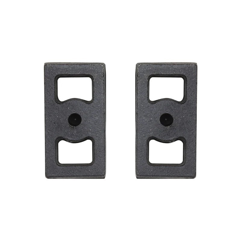 ICON Vehicle Dynamics 1-inch cast iron rear lift blocks with semi-gloss black finish and integrated center pins.