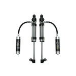 A pair of ICON RXT Omega Series 2.5 remote reservoir rear bypass shocks with black aluminum components for Toyota Tacoma.