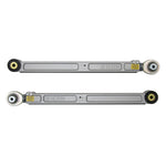 CNC-machined 6061 billet aluminum lower trailing arms with PTFE-lined rod ends and black nylon rock sliders.