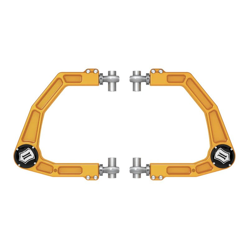 Gold anodized ICON 6061 billet aluminum upper control arm featuring Delta Joint PRO and FK rod end chassis pivots.
