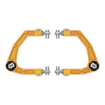 Gold anodized ICON 6061 billet aluminum upper control arm featuring Delta Joint PRO and FK rod end chassis pivots.