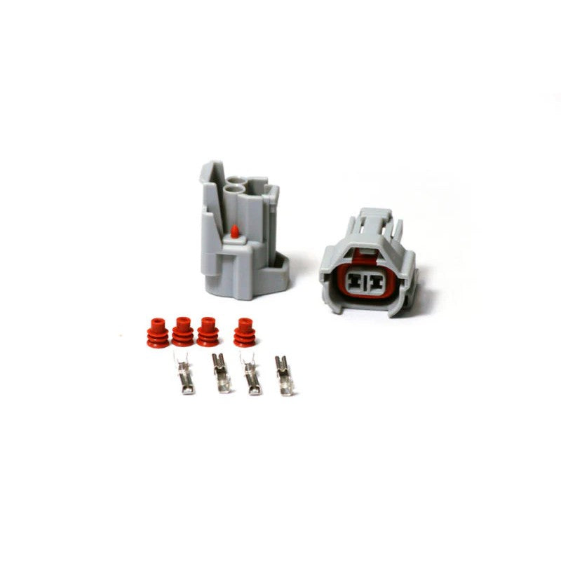 Injector Dynamics Denso-style female fuel injector connector housing with terminal pins