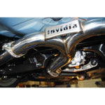 Invidia Q300 cat-back exhaust system featuring twin mufflers and four burnt titanium rolled tips for Subaru WRX STI.