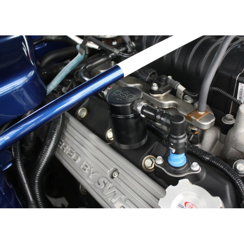 Black anodized J&L Oil Separator 3.0 for 2007-2014 Ford Mustang Shelby GT500 passenger side.