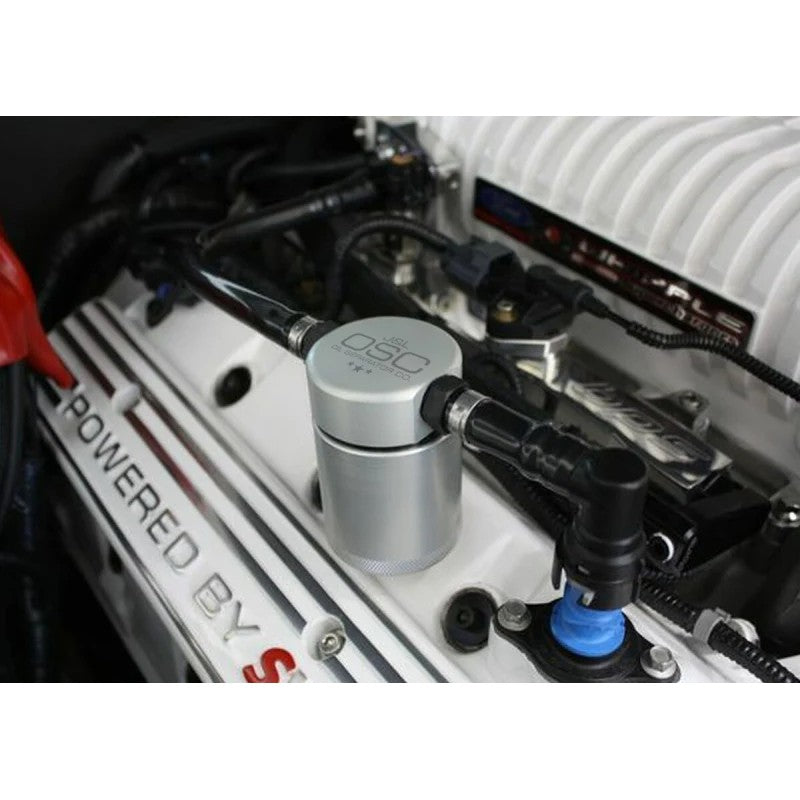 Clear anodized billet aluminum J&L 3.0 passenger side oil separator with black quick-connect PCV hoses.