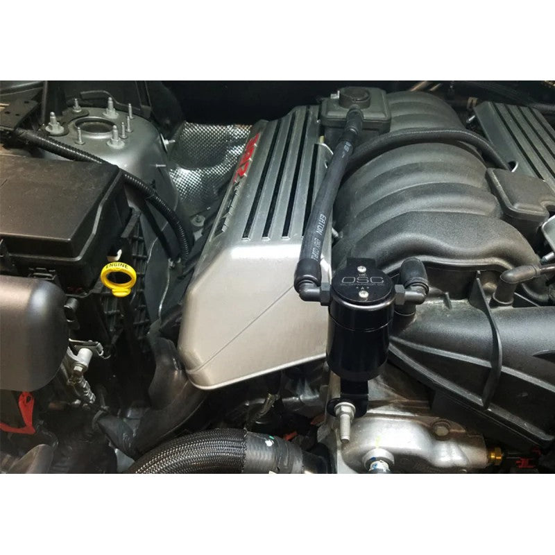 Black anodized billet aluminum J&L 3.0 oil separator with knurled base and passenger side mounting bracket.