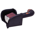 K&N 57 Series performance intake system featuring black HDPE tube, heat shield, and red oiled cotton air filter.