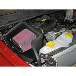K&N 57-1529 performance air intake system with black HDPE tube and conical red oiled cotton filter.