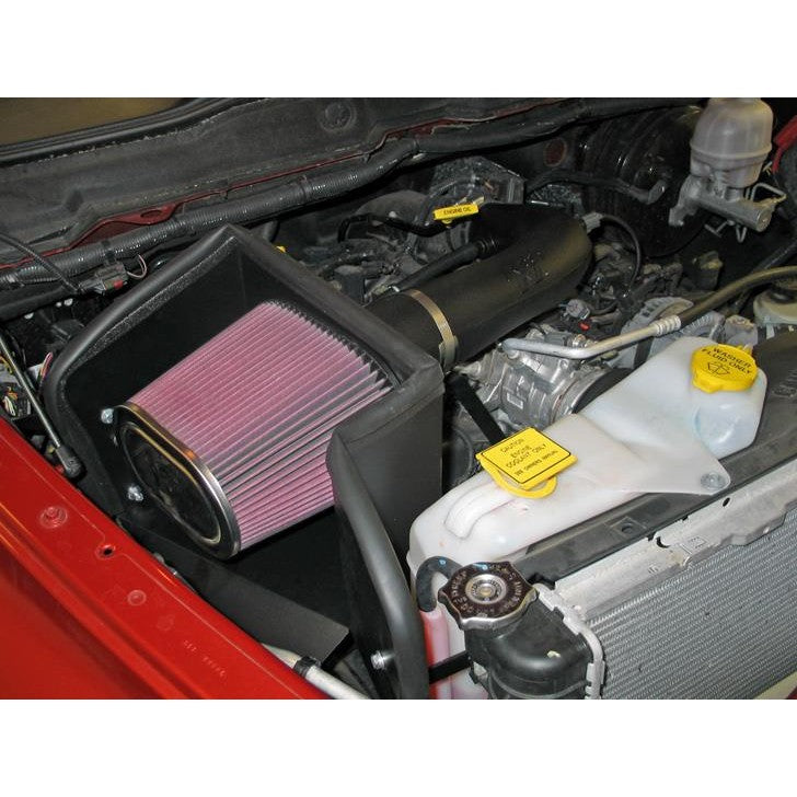 K&N 57-1529 performance air intake system with black HDPE tube and conical red oiled cotton filter.