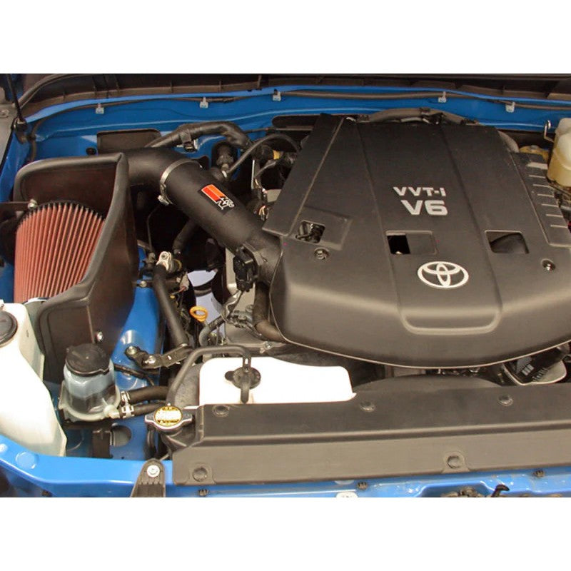 K&N AirCharger cold air intake system with black HDPE tube, oiled cotton filter, and heat shield for FJ Cruiser.