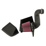K&N 57 Series air intake system with black HDPE tube, heat shield, and red oiled cotton filter for 6.6L Duramax trucks.