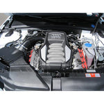 K&N E-1987 High-Flow drop-in air filter showing red pleated cotton media and durable rubber seal.