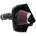 K&N Typhoon Series short ram air intake with black aluminum tube and red conical filter for Nissan Maxima.