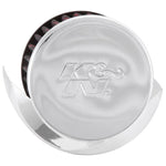 K&N 62-1513 crankcase vent filter with embossed chrome top, synthetic media, and integrated heat deflector shield.