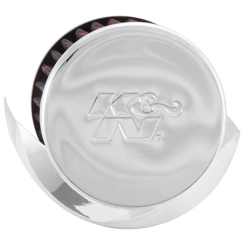 K&N 62-1513 crankcase vent filter with embossed chrome top, synthetic media, and integrated heat deflector shield.