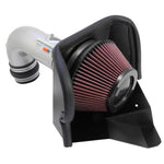 K&N 69-Series Typhoon intake with silver mandrel-bent aluminum tube, red conical filter, and black heat shield.