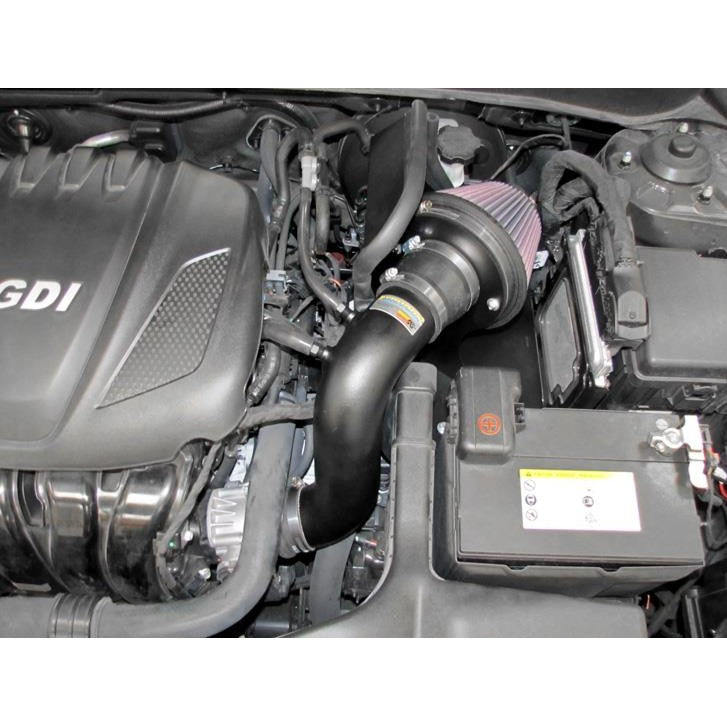 K&N Typhoon Short Ram Intake featuring a black mandrel-bent aluminum tube and a red conical oiled cotton air filter.