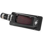 K&N 69 Series Typhoon cold air intake kit with mandrel-bent aluminum tubing and a red conical oiled cotton air filter.