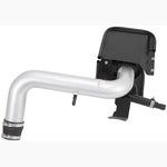 K&N Typhoon performance intake system with silver mandrel-bent aluminum tube, red conical air filter, and black heat shield.