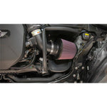 K&N Typhoon intake system with a black aluminum tube, red conical air filter, and custom heat shield.
