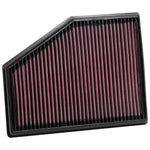 K&N 33-3079 high-flow replacement air filter with red oiled cotton media in a rectangular panel frame.