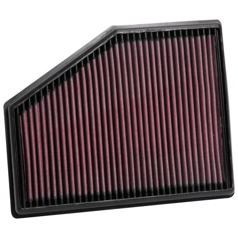 K&N 33-3079 high-flow replacement air filter with red oiled cotton media in a rectangular panel frame.