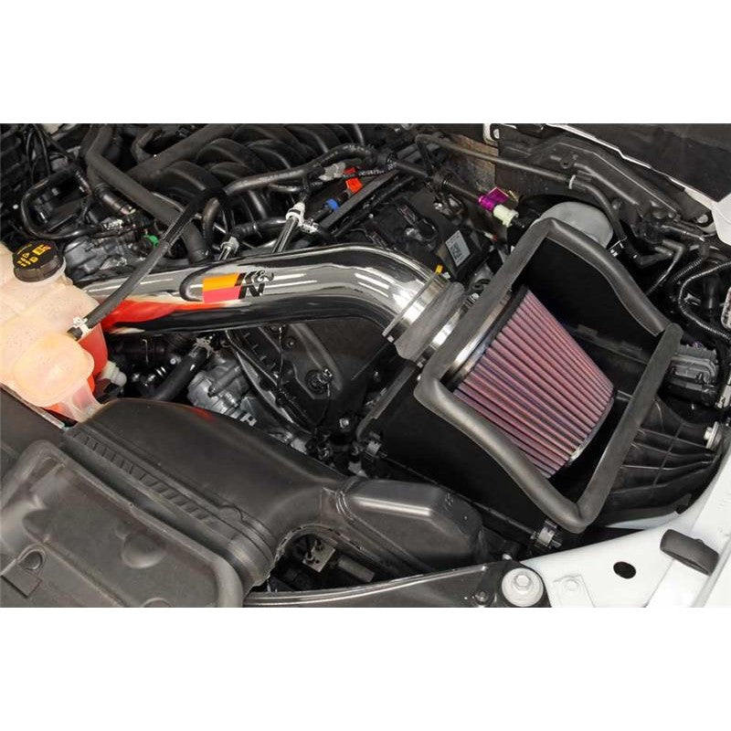K&N 77 Series cold air intake system featuring a polished aluminum tube and red oiled cotton conical air filter.
