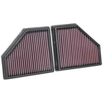 K&N 33-5086 high-flow drop-in air filter with red oiled cotton media and a durable black frame for BMW engines.