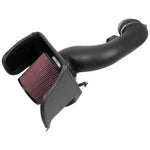 K&N 57-2597 performance intake system with black HDPE tube, heat shield, and red oiled cotton conical air filter.