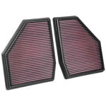 Set of two K&N 33-3128 replacement air filters with red pleated oiled cotton media and black flexible frames.