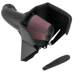 K&N AirCharger performance intake system with black HDPE tube, conical red air filter, and custom metal heat shield.