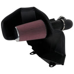 K&N 63-3115 AirCharger intake system with black HDPE tube, conical red oiled air filter, and custom heat shield.
