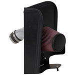 K&N Typhoon air intake system with silver mandrel-bent aluminum tube and red conical oiled cotton filter.