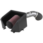 K&N performance cold air intake system with mandrel-bent aluminum tube and red oiled air filter for 6.6L HD trucks.