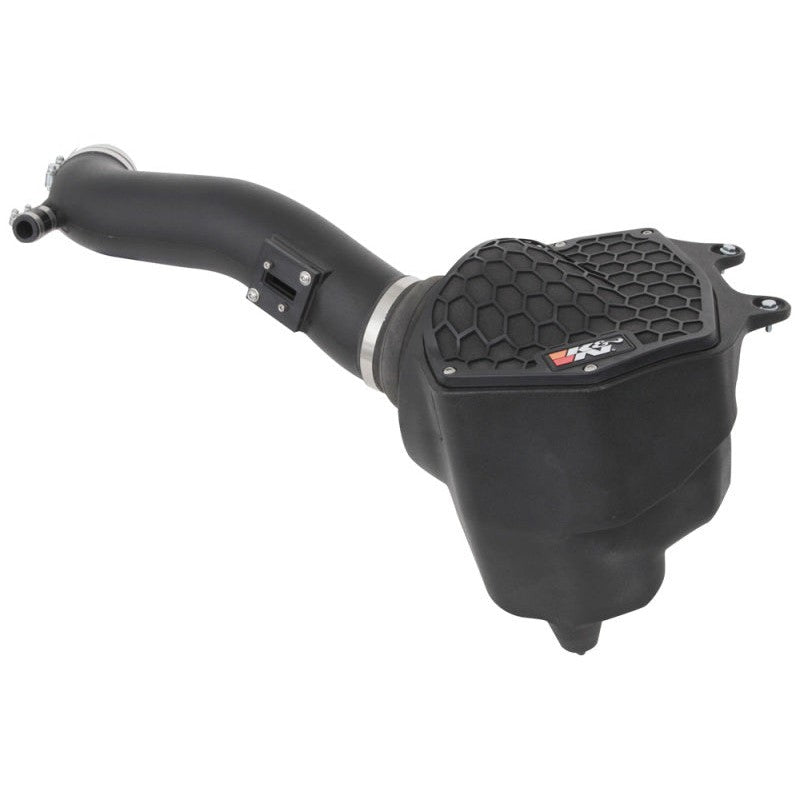 K&N AirCharger performance intake with black HDPE tube, enclosed air box, and red oiled cotton conical air filter.