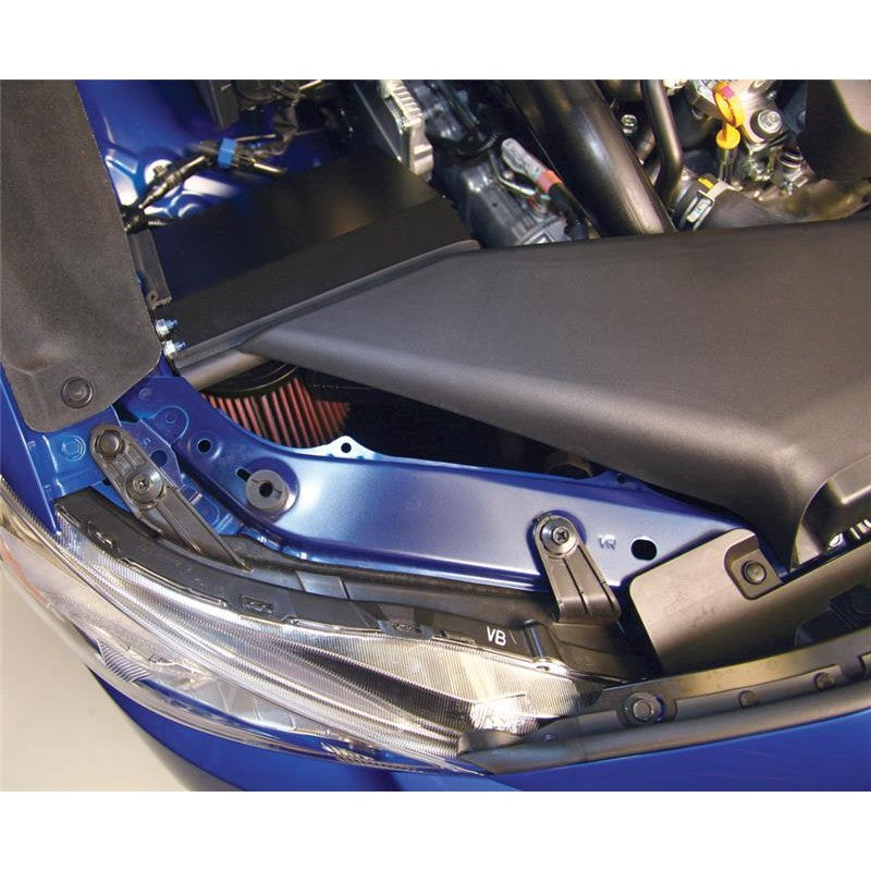 K&N Typhoon black powder-coated aluminum intake tube with red conical air filter and heat shield for Subaru WRX.