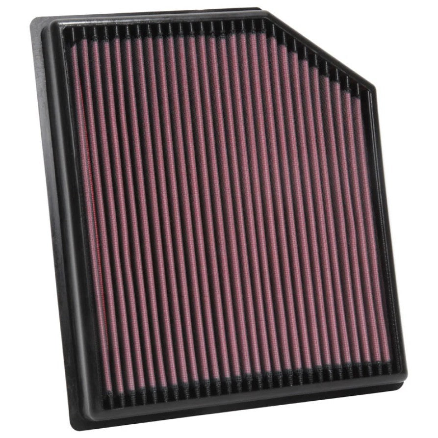 K&N 33-5077 high-flow replacement air filter with red pleated oiled cotton media and black flexible frame.