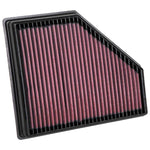 K&N 33-3136 drop-in high-flow air filter with red pleated oiled cotton media and a black polyurethane frame.
