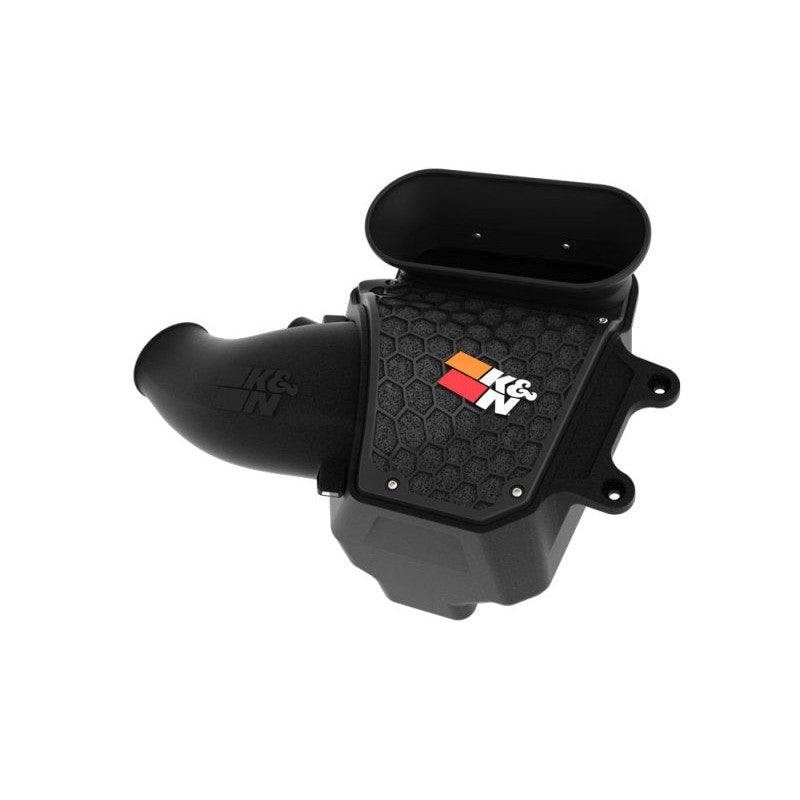 K&N AirCharger intake system with black HDPE tube, heat shield, and red oiled cotton air filter for Jeep Wrangler 6.4L.