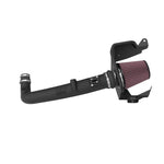 K&N AirCharger intake system with black HDPE tube, custom heat shield, and red oiled cotton conical air filter