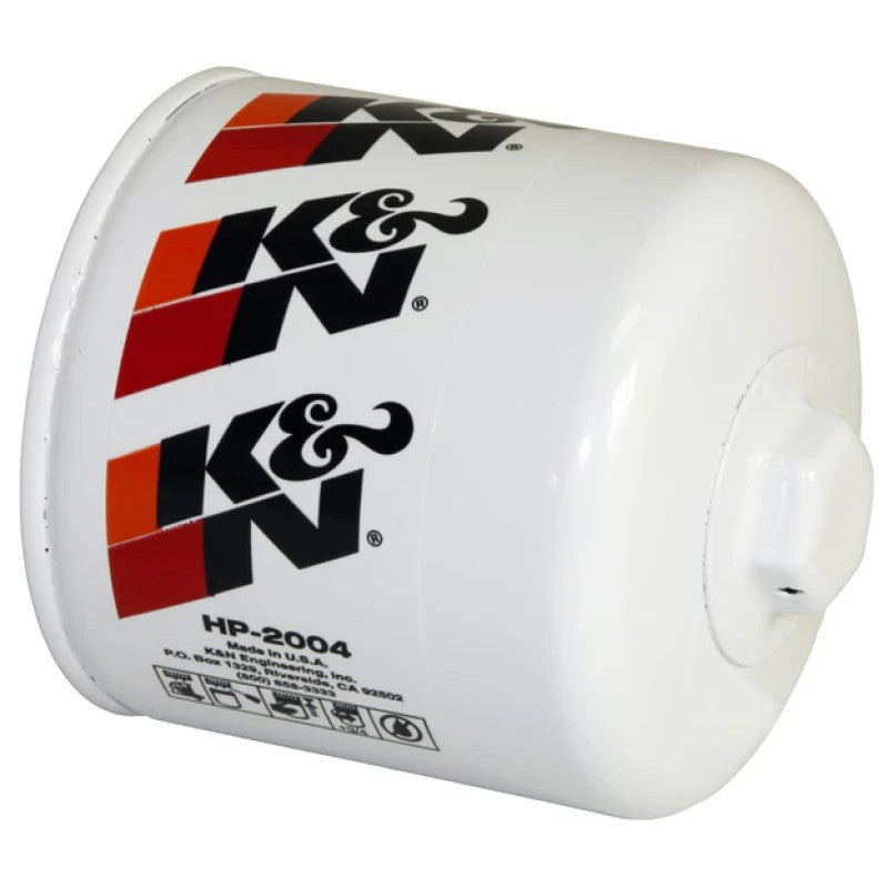 K&N HP-2004 Performance Gold oil filter featuring a white heavy-duty canister with a 1-inch welded hex nut on the end.