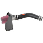 K&N 57-9012 performance air intake kit with black HDPE tube and red conical oiled cotton filter.