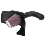 K&N performance intake kit featuring black HDPE tube, oiled cotton air filter, and custom heat shield for V8 engines.