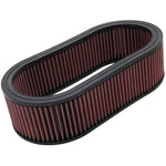 K&N E-3514 oval high-flow air filter featuring pleated pink oiled cotton media and black rubber seals.