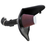 K&N 57 Series FIPK air intake system featuring a black HDPE tube, custom heat shield, and red oiled cotton air filter