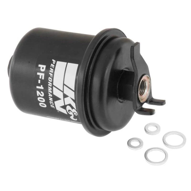 K&N PF-1200 performance fuel filter with a high-strength black carbon steel housing and rolled seam construction.