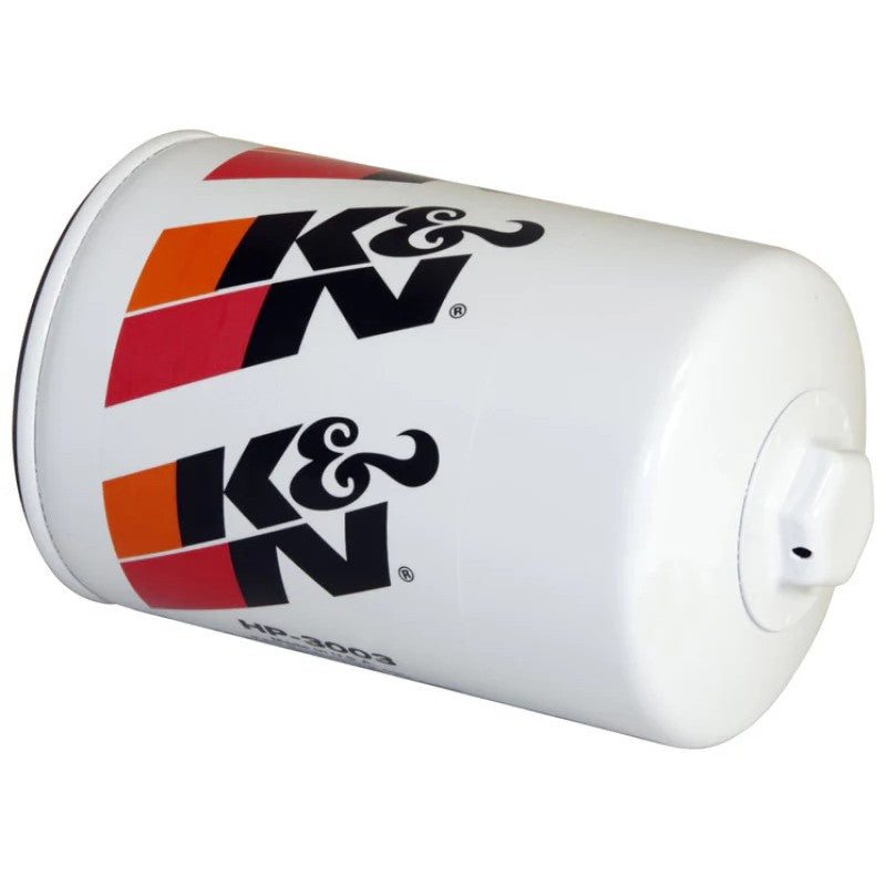 K&N HP-3003 premium oil filter showing the 1-inch welded hex nut on a heavy-duty white canister.
